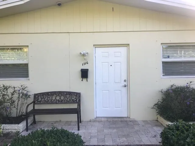 a view of a door and wooden floor