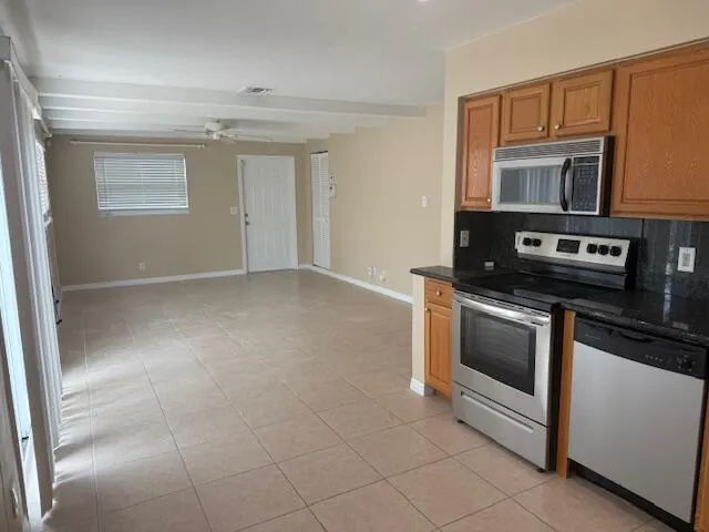 a kitchen with a stove and a microwave