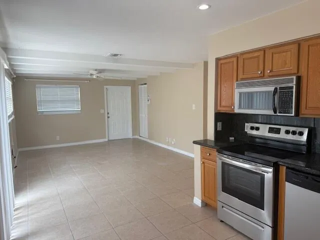 a kitchen with a stove and a microwave