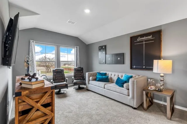 a bedroom with furniture and a window