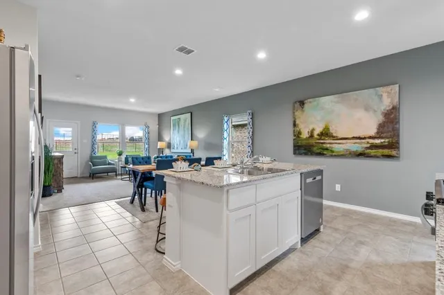 a view of a kitchen and dining area