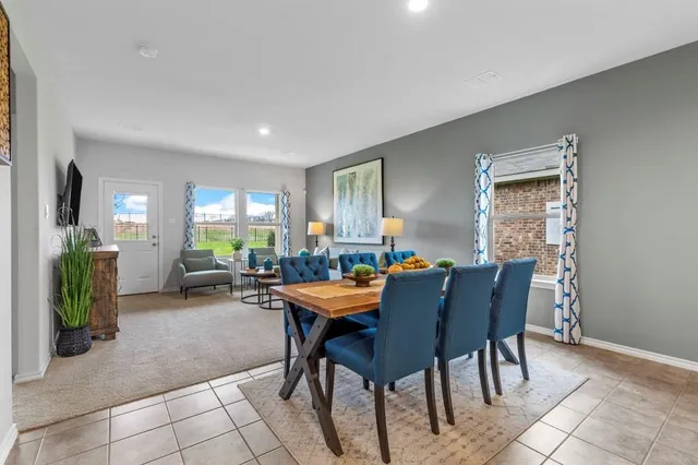 a view of a kitchen and dining area