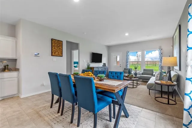 a kitchen with granite countertop a sink stove and cabinets