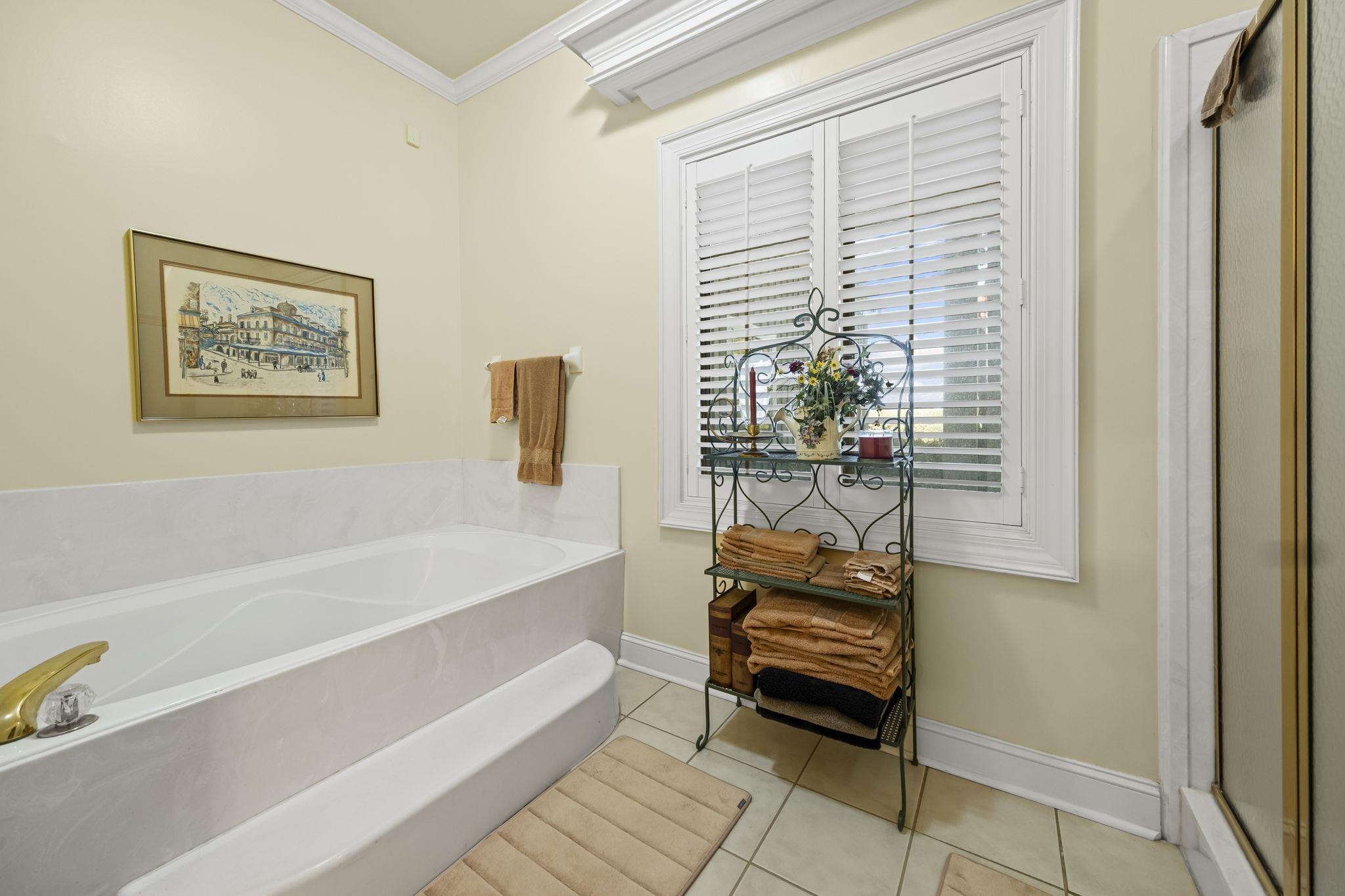 450 Cherry Road Eads, TN 38028 - Photo 18 of 24 Full bathroom with light tile patterned floors, crown molding, and a bath