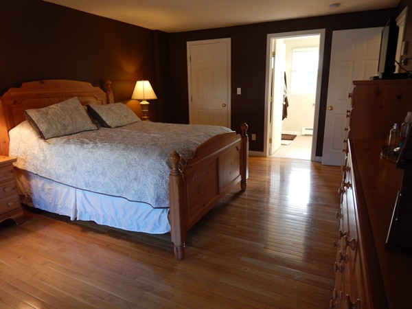 12 Azel Road Freetown, MA 02717 - Photo 17 of 30 a bedroom with a bed and wooden floor