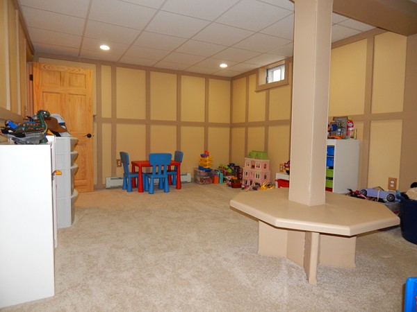12 Azel Road Freetown, MA 02717 - Photo 25 of 30 a room with gym equipment and a large window