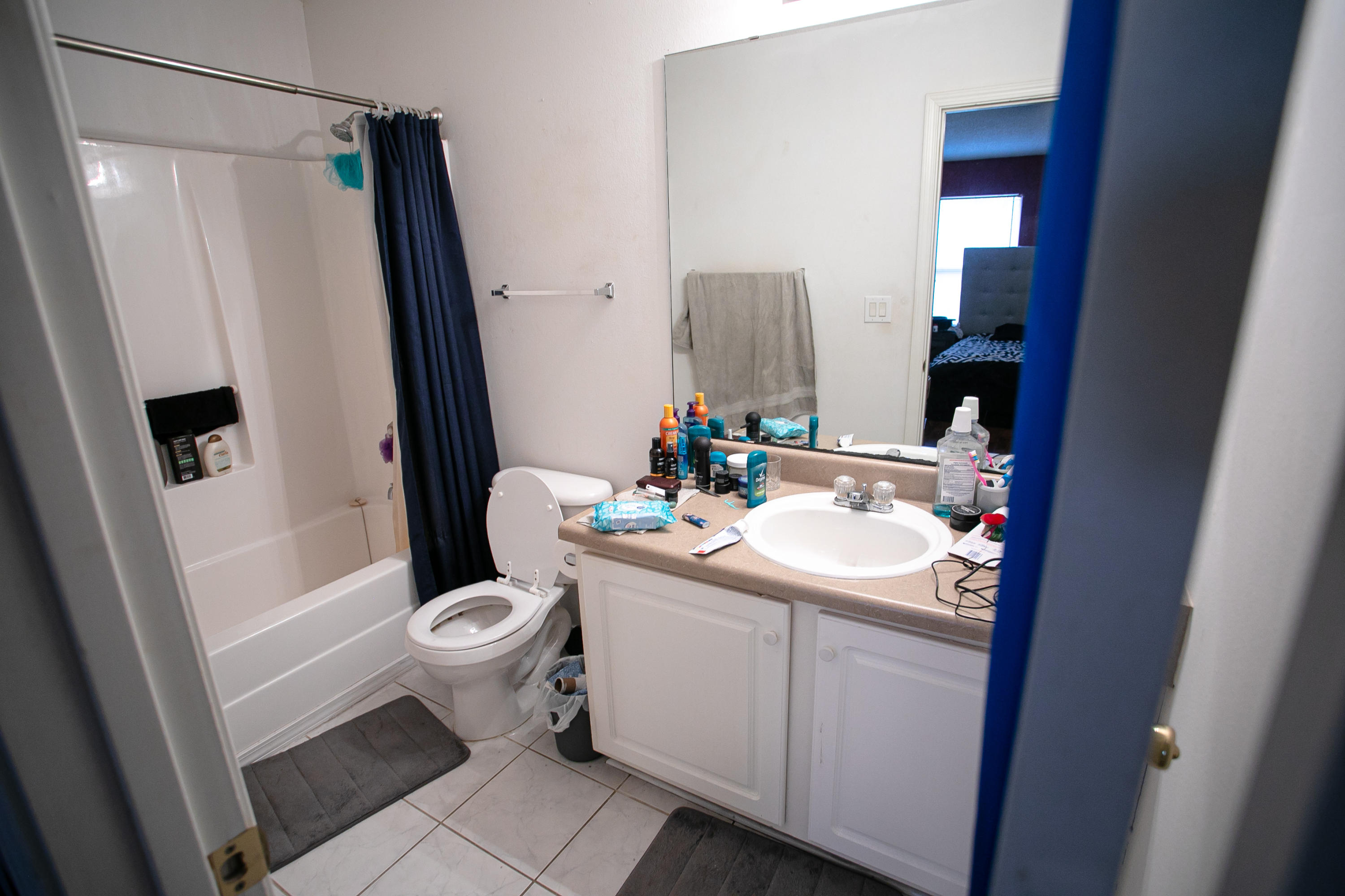 507 Keystone Road Mary Esther, FL 32569 - Photo 22 of 30 a bathroom with a sink a toilet a mirror and shower curtain