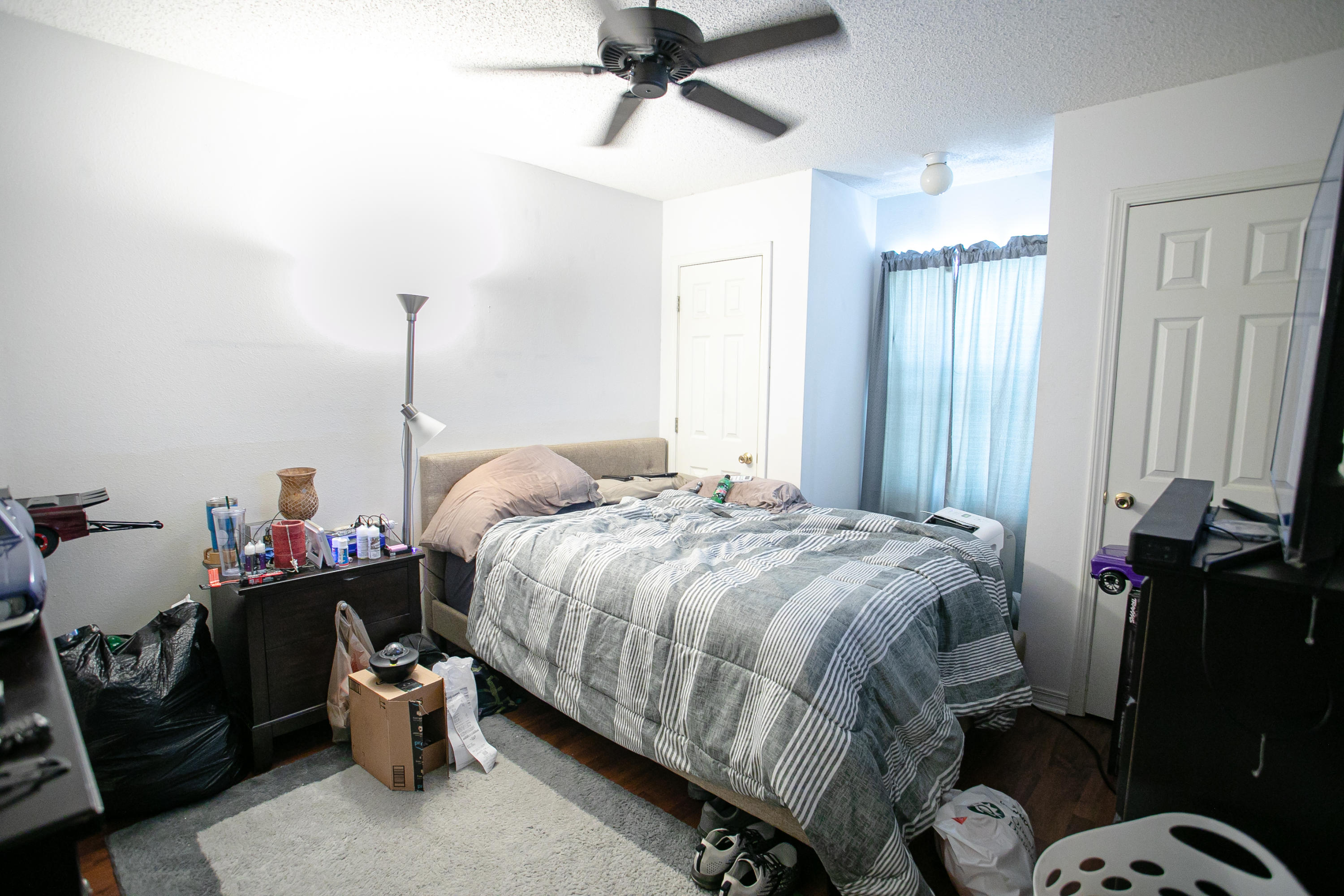 507 Keystone Road Mary Esther, FL 32569 - Photo 24 of 30 a bedroom with a bed and a chandelier