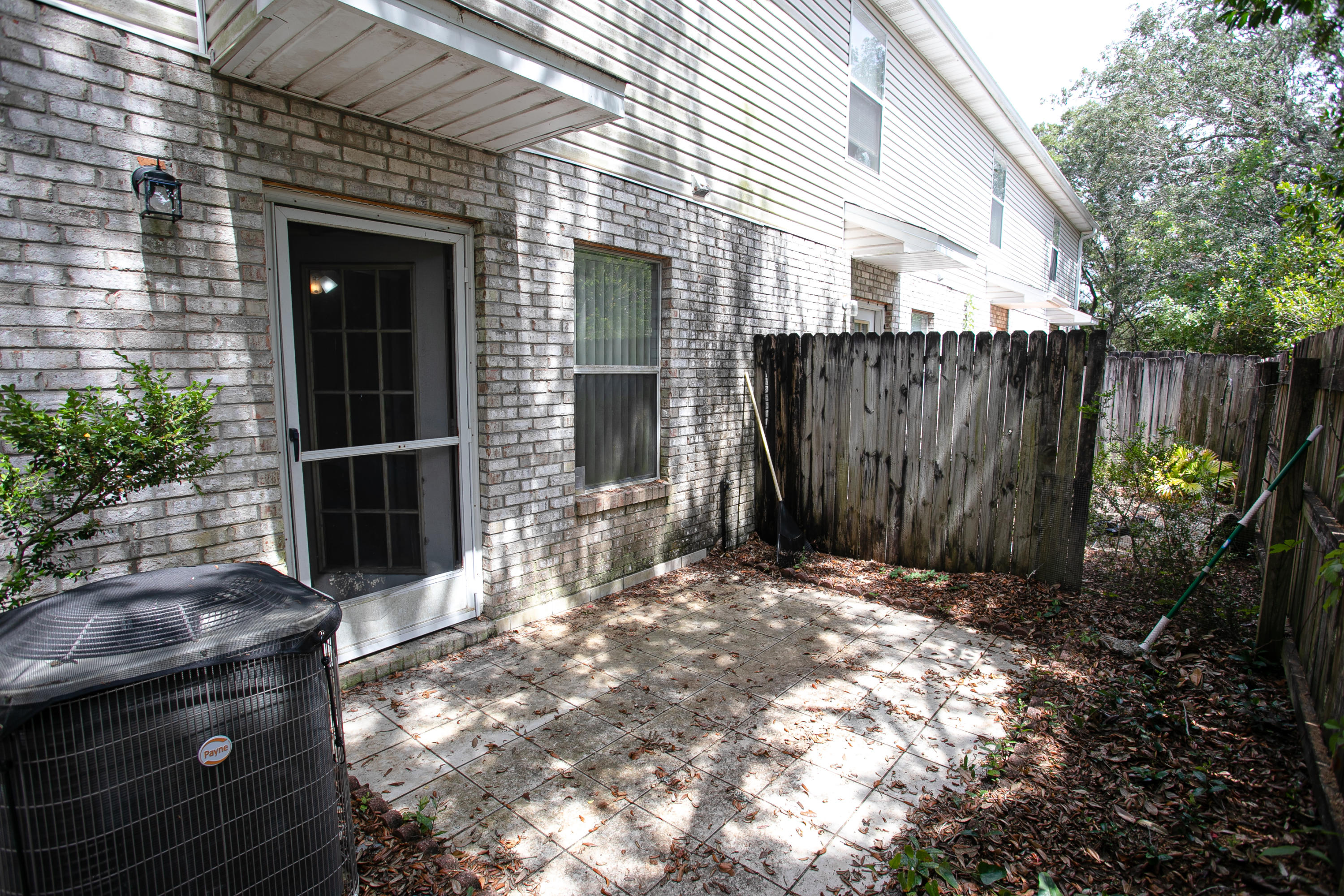 507 Keystone Road Mary Esther, FL 32569 - Photo 30 of 30 a view of a house with a large window and wooden fence