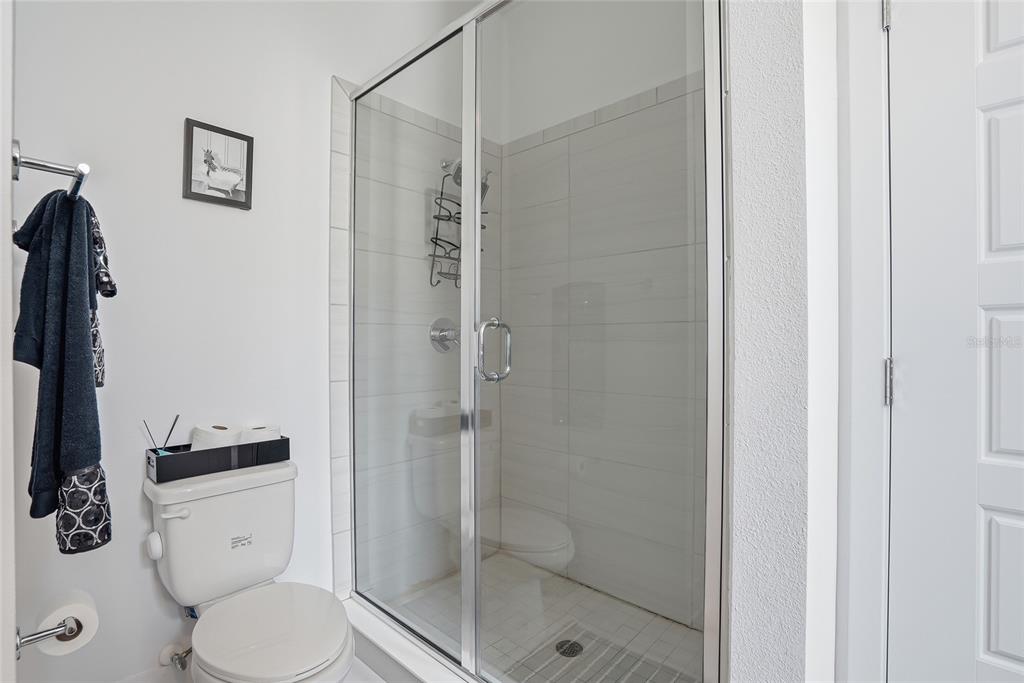 4810 West McElroy Avenue, Unit 30 Tampa, FL 33611 - Photo 28 of 43 a white toilet sitting next to a bathroom sink
