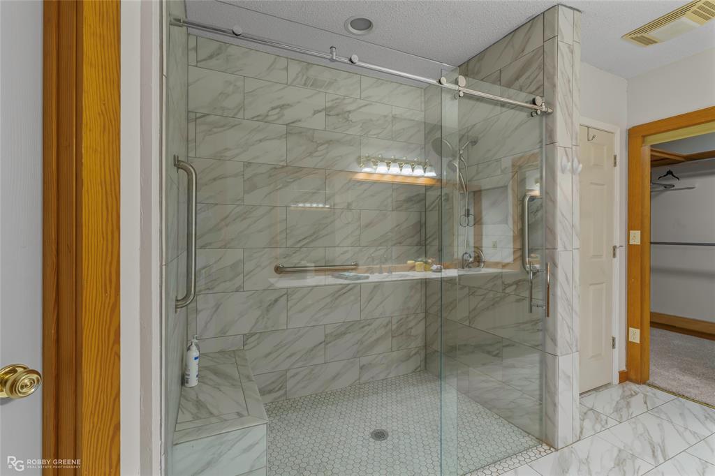 184 Hall Road Stonewall, LA 71078 - Photo 11 of 21 a bathroom with a glass shower door