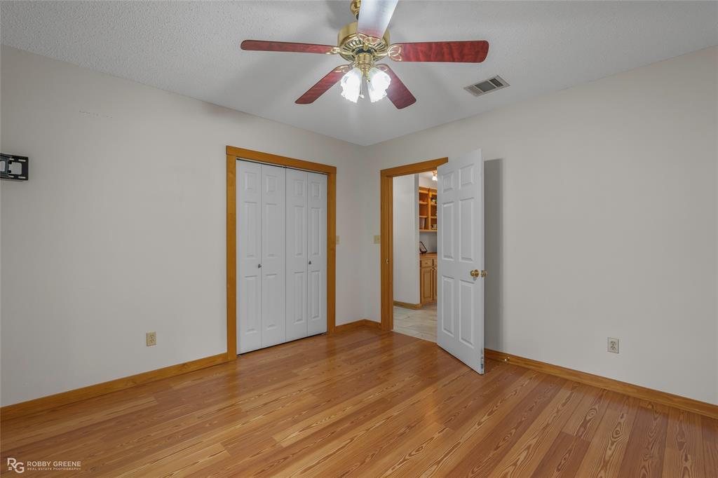 184 Hall Road Stonewall, LA 71078 - Photo 14 of 21 a view of a room with a ceiling fan and a window