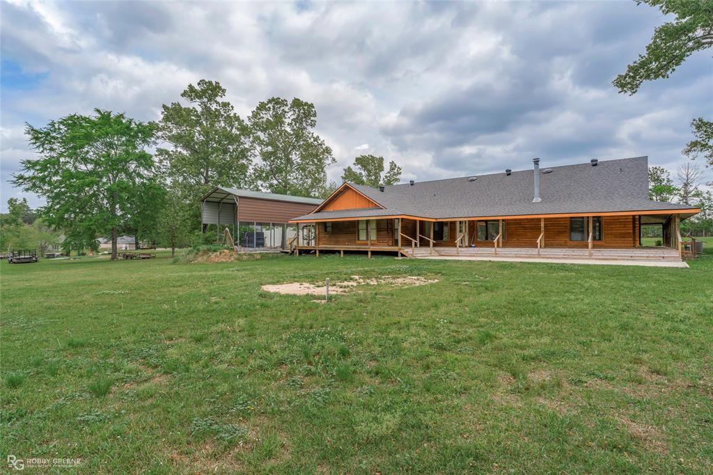 184 Hall Road Stonewall, LA 71078 - Photo 2 of 21 a front view of house with yard and green space