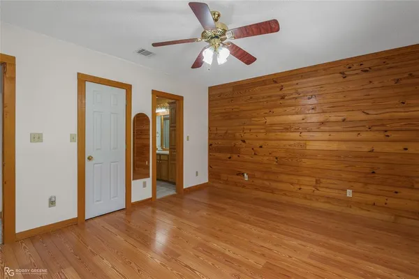 a view of a garden with large trees