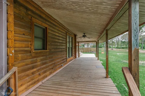 a view of empty room with a fireplace and fan