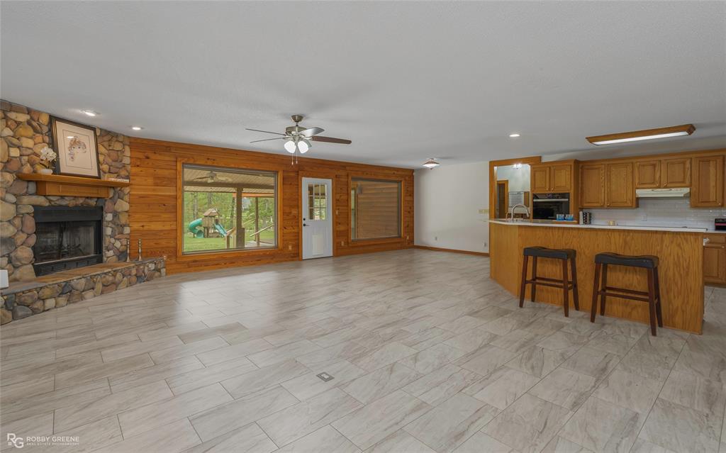 184 Hall Road Stonewall, LA 71078 - Photo 21 of 21 a view of a kitchen with furniture and a fireplace