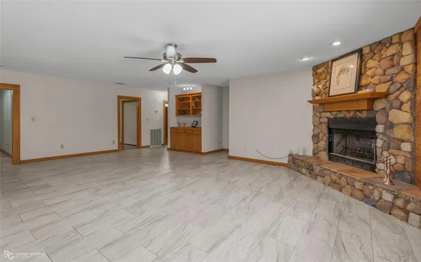 a kitchen with stainless steel appliances granite countertop a sink and a refrigerator