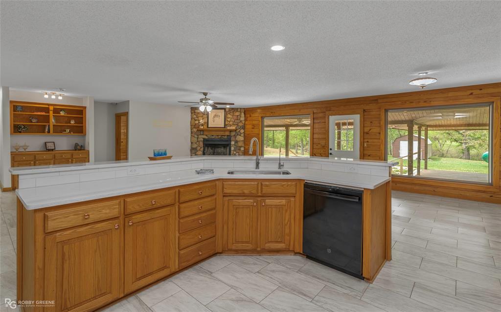 184 Hall Road Stonewall, LA 71078 - Photo 5 of 21 a spacious bathroom with a granite countertop sink and a large mirror