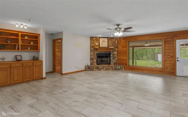 a view of a room with closet and a ceiling fan
