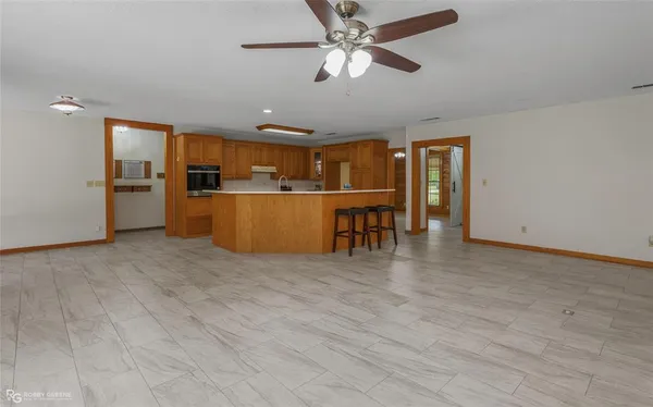 an empty room with windows and closet