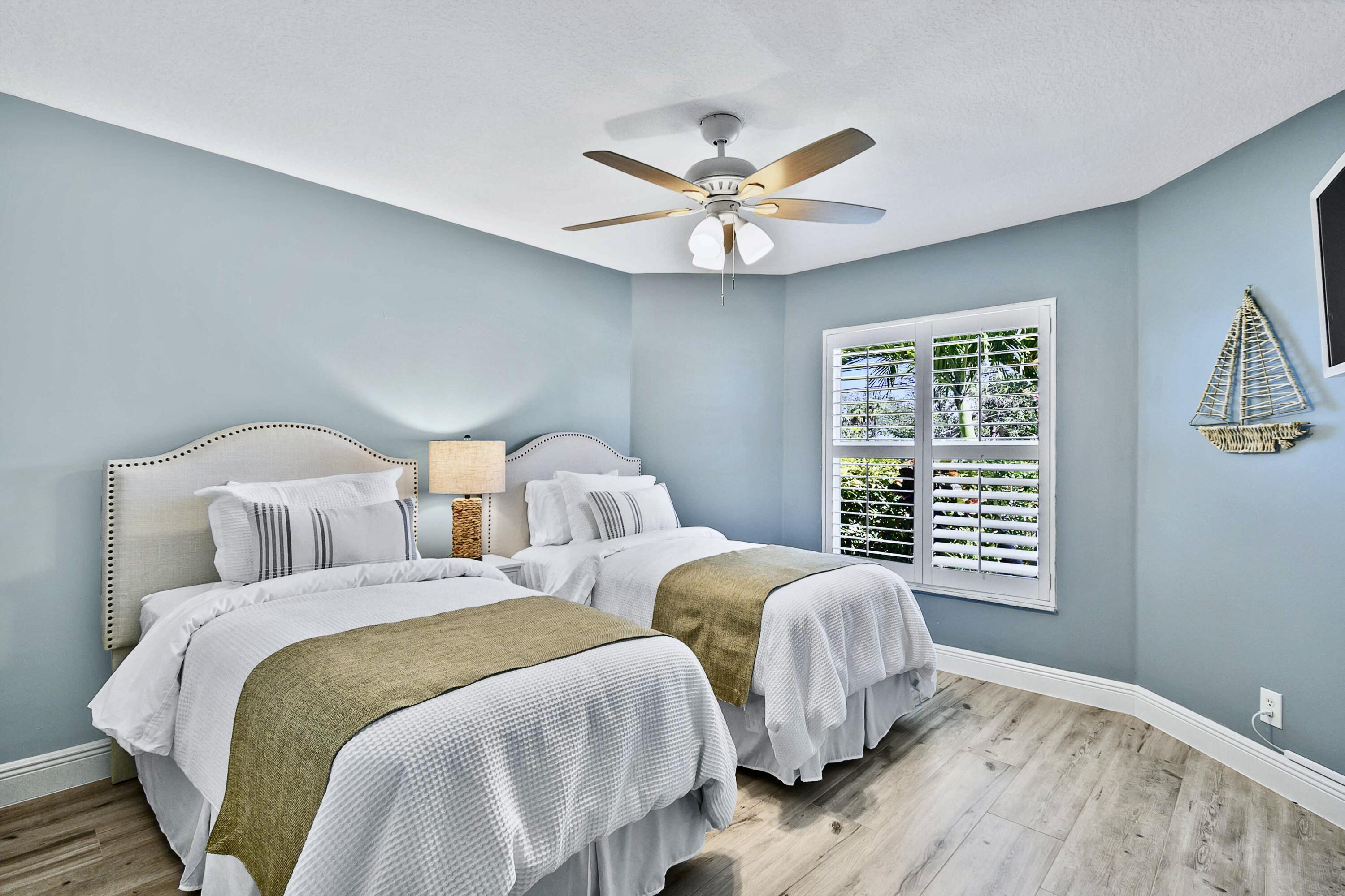 104 Old Jupiter Beach Road Jupiter, FL 33477 - Photo 14 of 17 a bedroom with two beds and a window