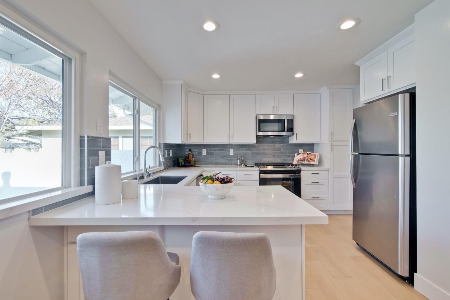 686 Thornapple Drive Sunnyvale, CA 94086 - Photo 27 of 83 a kitchen with a refrigerator a stove a sink and a counter