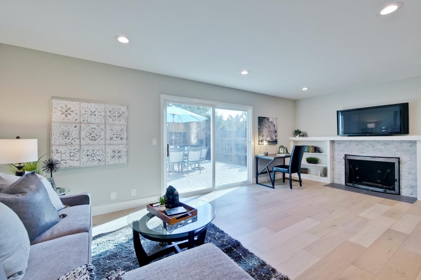 686 Thornapple Drive Sunnyvale, CA 94086 - Photo 39 of 83 a living room with furniture and a fireplace