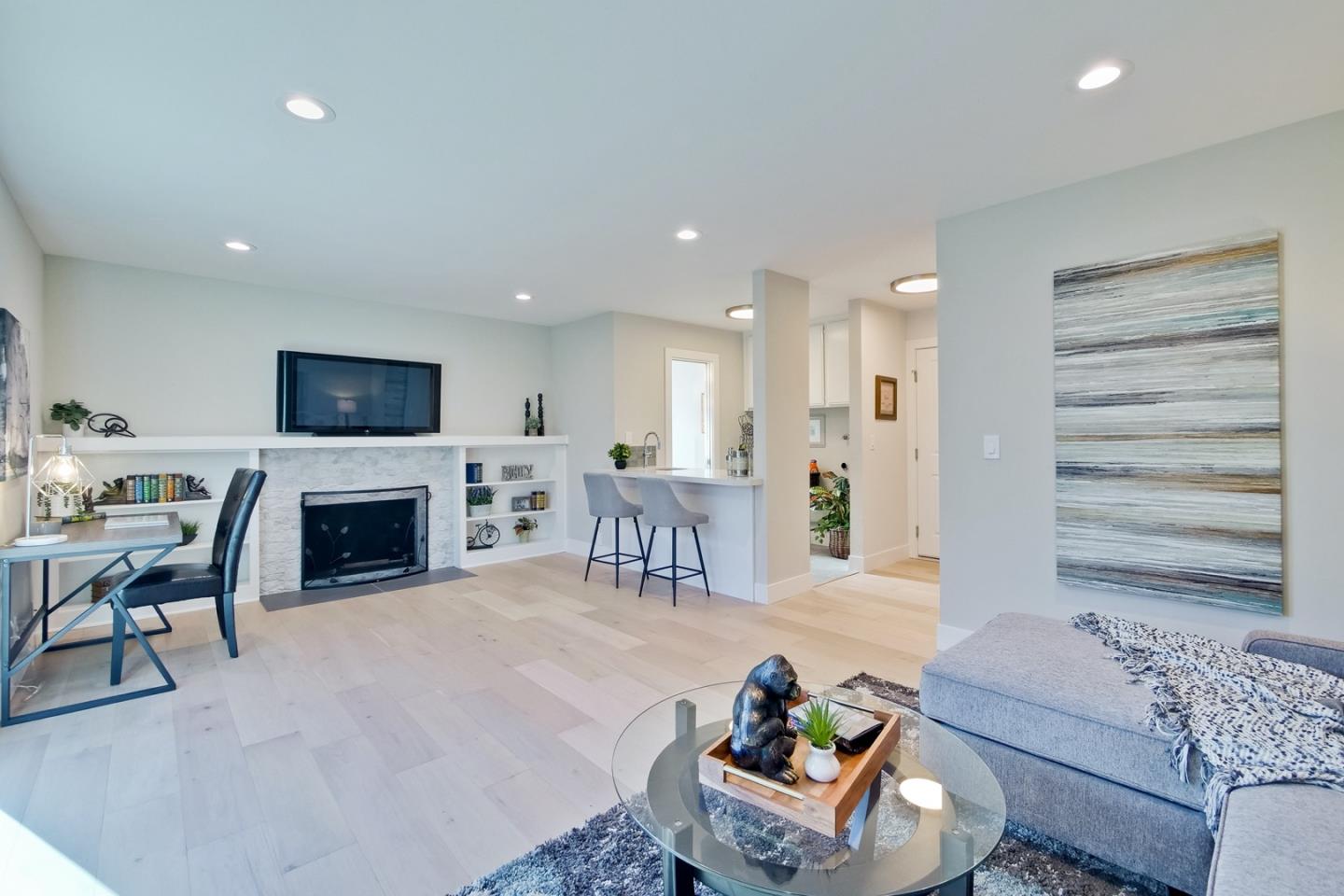 686 Thornapple Drive Sunnyvale, CA 94086 - Photo 41 of 83 a living room with fireplace furniture and a flat screen tv