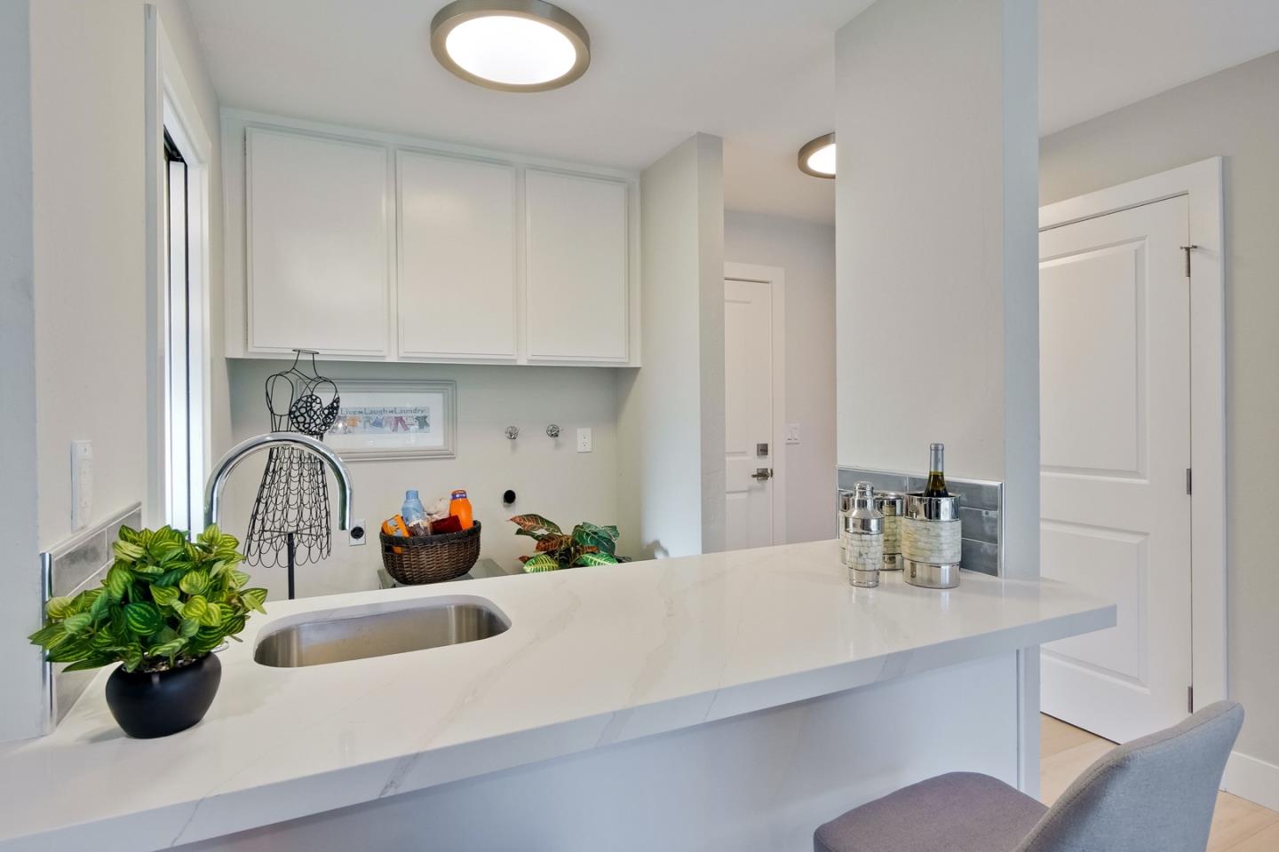 686 Thornapple Drive Sunnyvale, CA 94086 - Photo 48 of 83 a kitchen with a sink and a potted plant