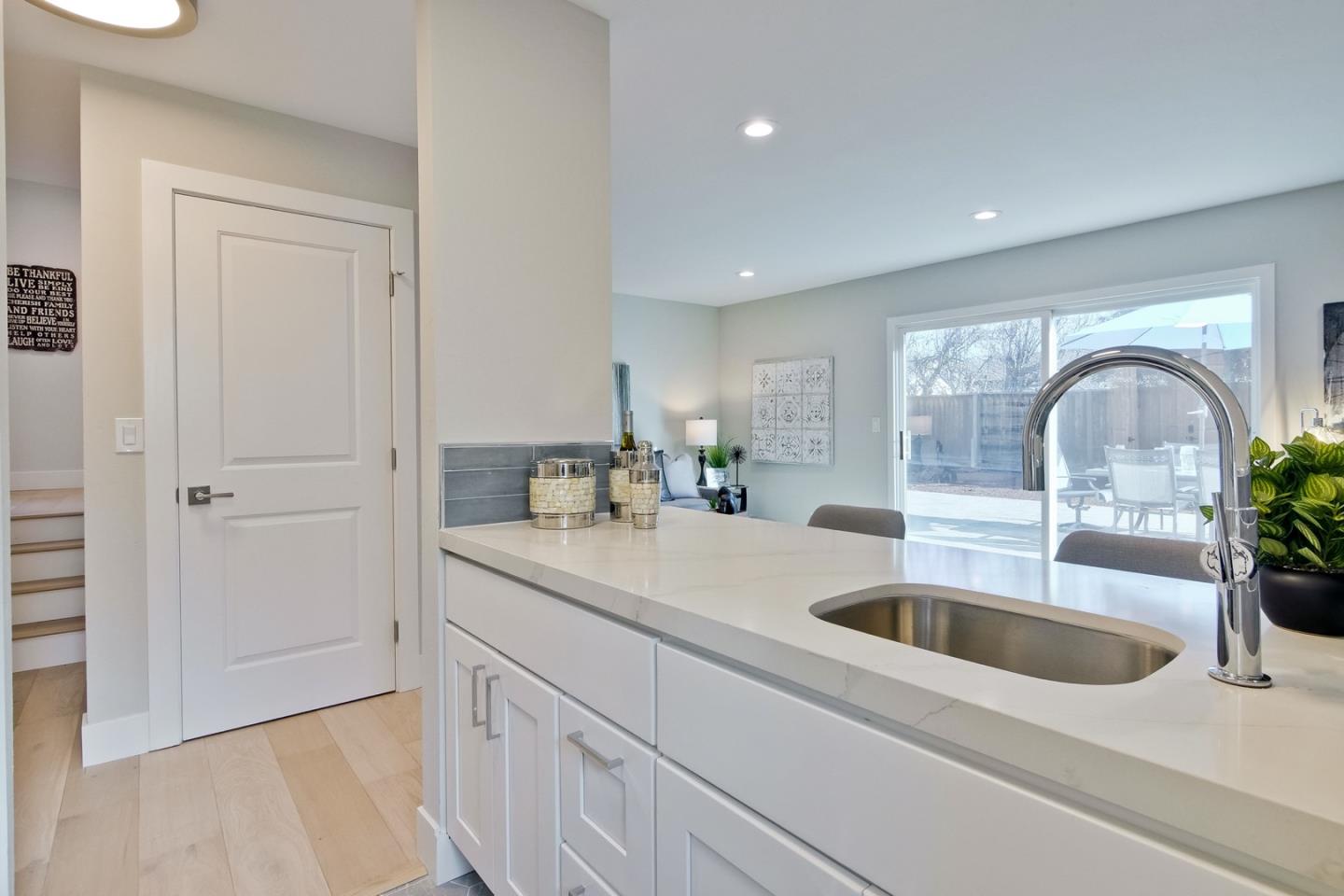 686 Thornapple Drive Sunnyvale, CA 94086 - Photo 50 of 83 a kitchen with sink a refrigerator and cabinets