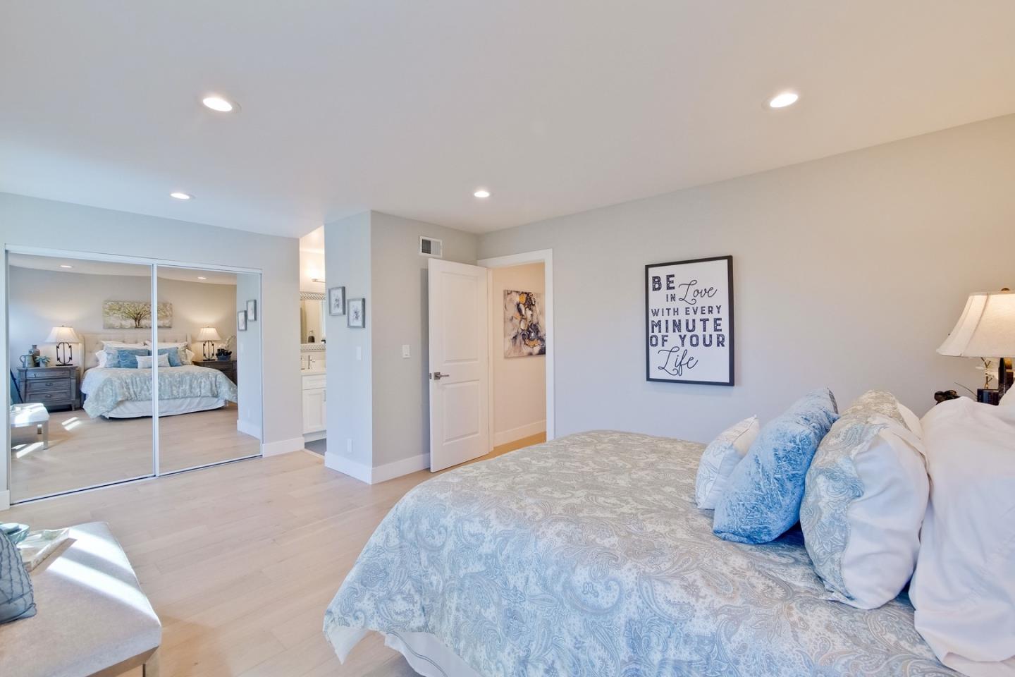 686 Thornapple Drive Sunnyvale, CA 94086 - Photo 54 of 83 a bedroom with a large bed and a view of living room