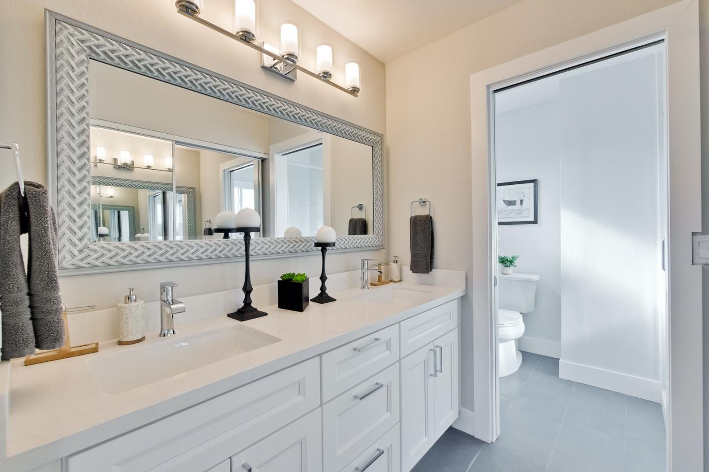 686 Thornapple Drive Sunnyvale, CA 94086 - Photo 58 of 83 a bathroom with a double vanity sink and a mirror