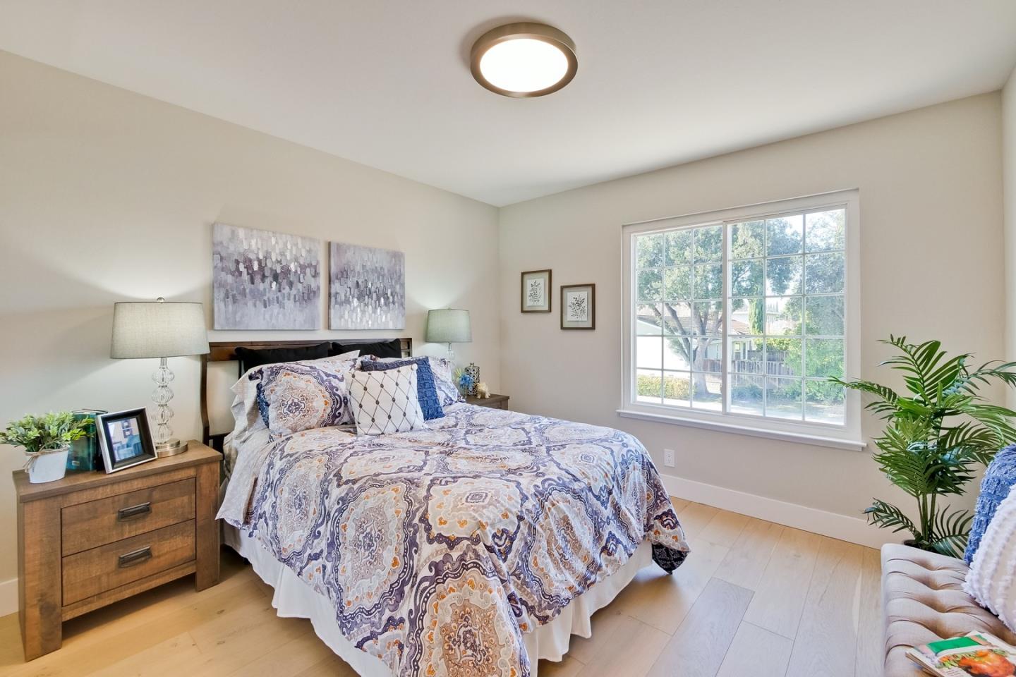 686 Thornapple Drive Sunnyvale, CA 94086 - Photo 61 of 83 a bedroom with a bed and a window