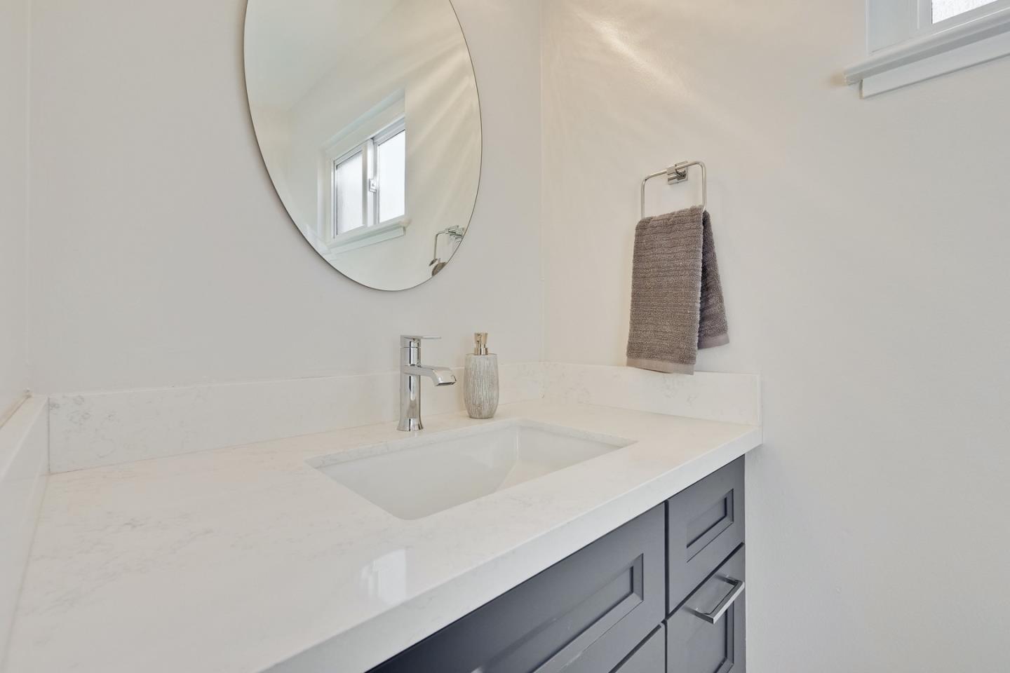686 Thornapple Drive Sunnyvale, CA 94086 - Photo 69 of 83 a bathroom with a sink and a mirror