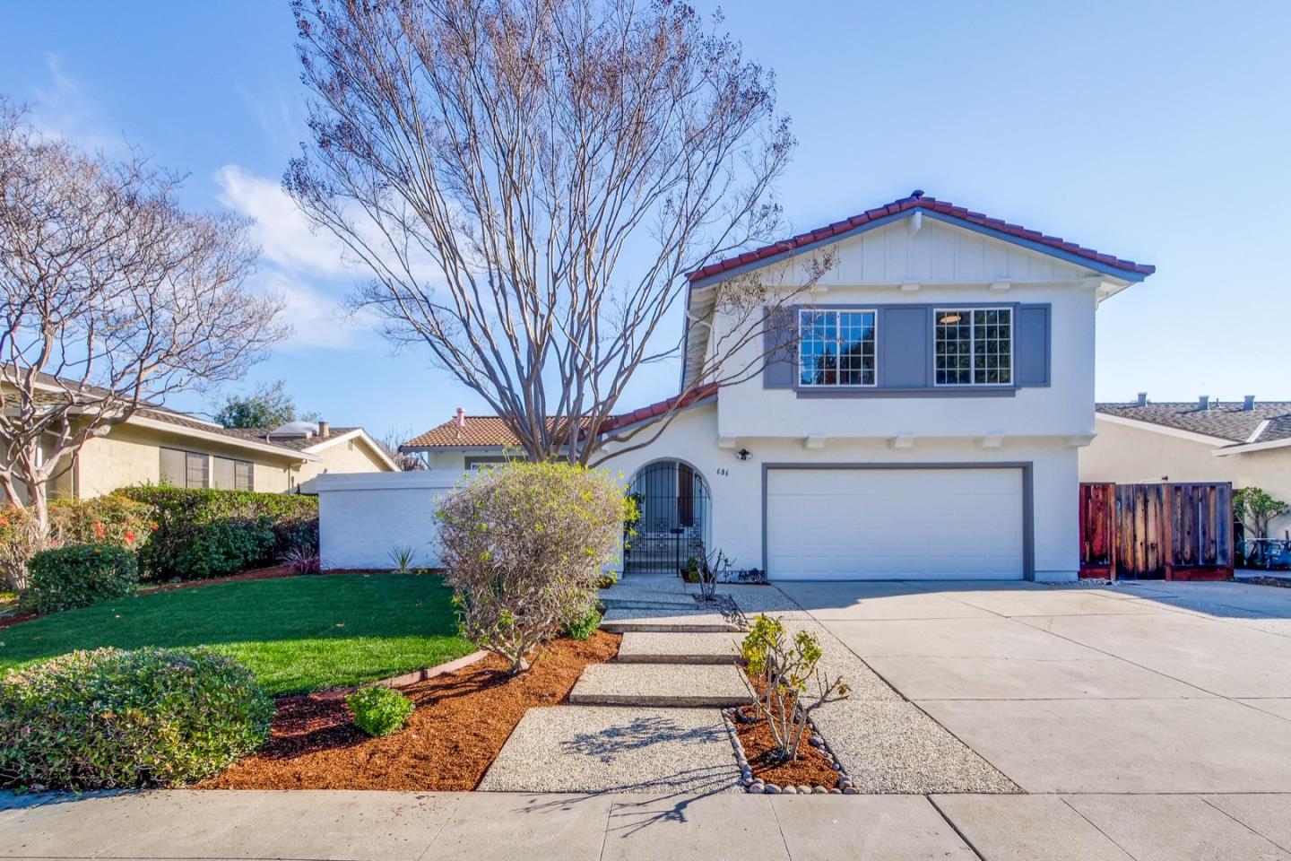 686 Thornapple Drive Sunnyvale, CA 94086 - Photo 7 of 83 a front view of a house with a yard and garage