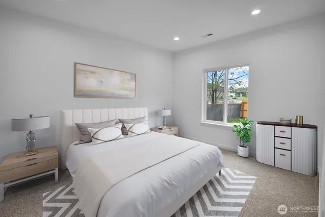 a bedroom with a bed and ceiling fan