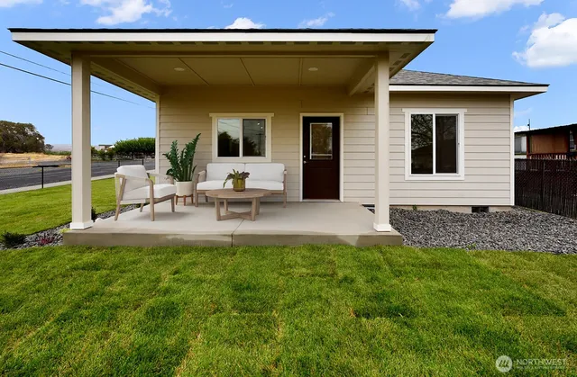 a view of house with backyard porch and patio