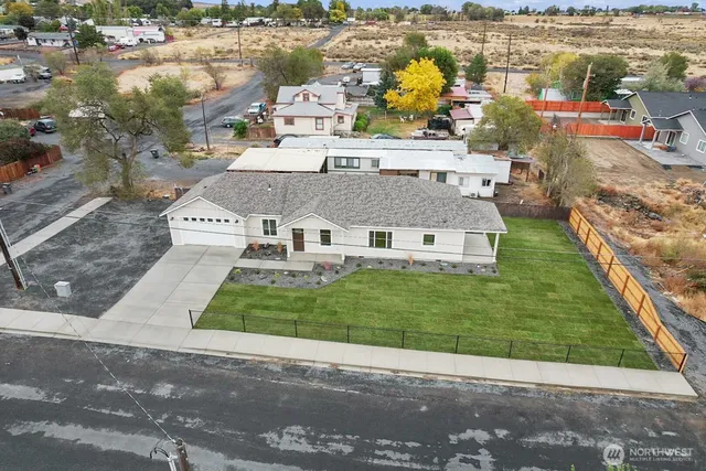 an aerial view of a house with a ocean view
