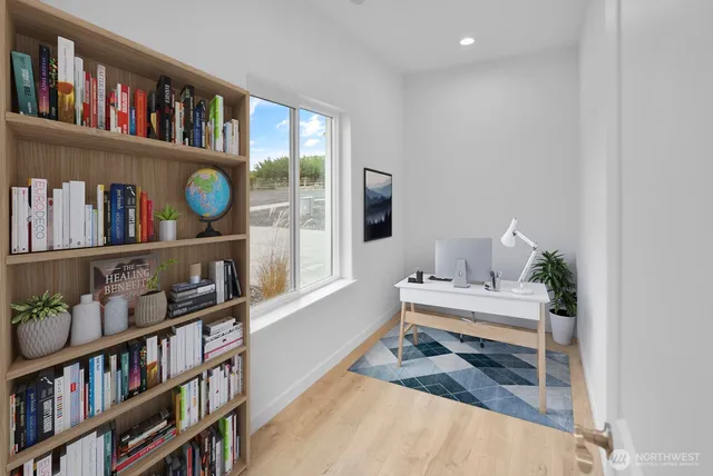 a workspace with furniture and a book shelf