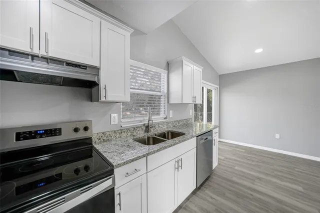 a kitchen with a sink and cabinets