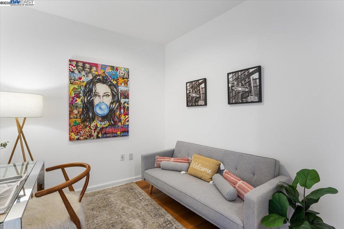 200 2nd Street, Unit 503 Oakland, CA 94607 - Photo 11 of 35 a living room with furniture and a painting on the wall