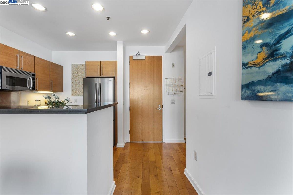 200 2nd Street, Unit 503 Oakland, CA 94607 - Photo 12 of 35 a kitchen with stainless steel appliances granite countertop a refrigerator and a stove top oven