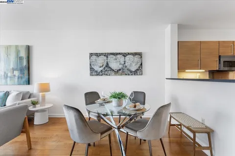 a view of a dining room with furniture and a potted plant