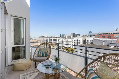 a view of a balcony with furniture