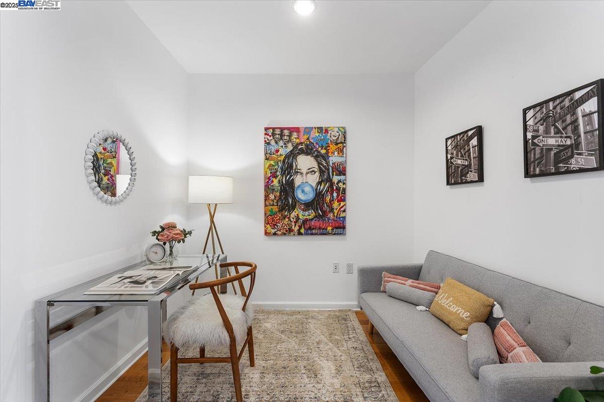 200 2nd Street, Unit 503 Oakland, CA 94607 - Photo 4 of 35 a living room with furniture and wall paintings