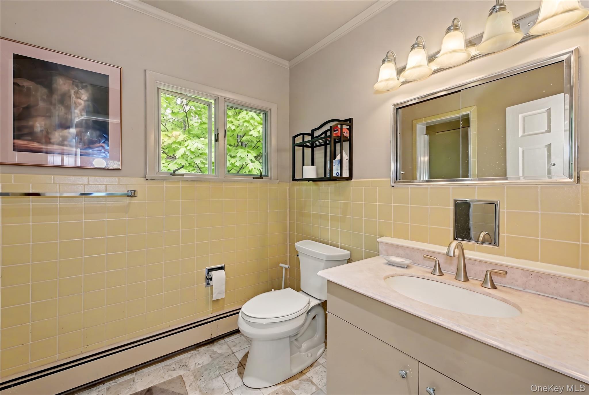 631 Croton Falls Road Carmel, NY 10512 - Photo 27 of 43 a bathroom with a granite countertop toilet a sink and mirror