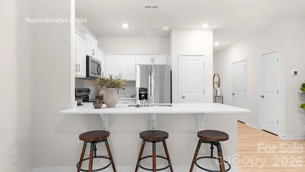 a kitchen with stainless steel appliances a sink and cabinets