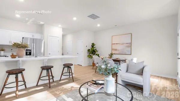 a living room with furniture and a table