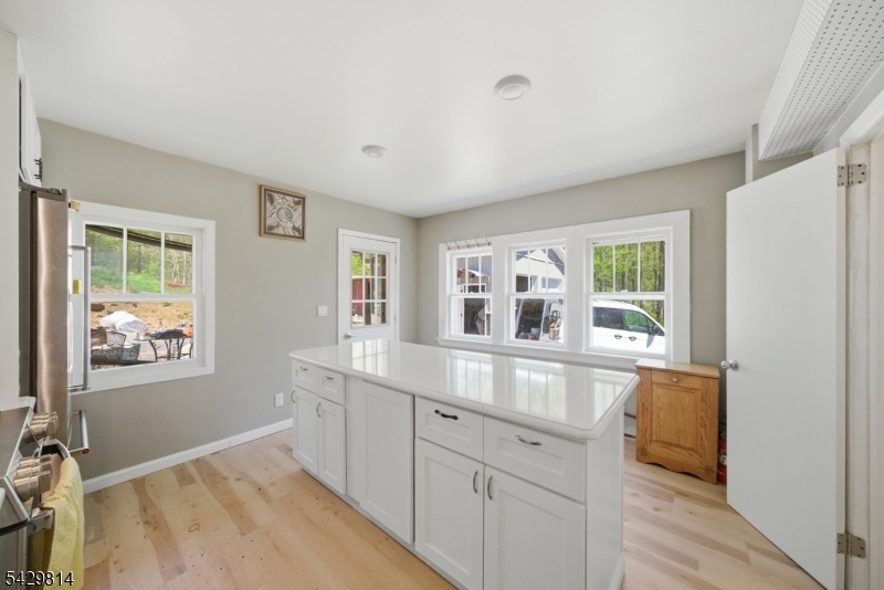 251 Russia Road Oak Ridge, NJ 07438 - Photo 8 of 34 a view of a kitchen counter space and windows