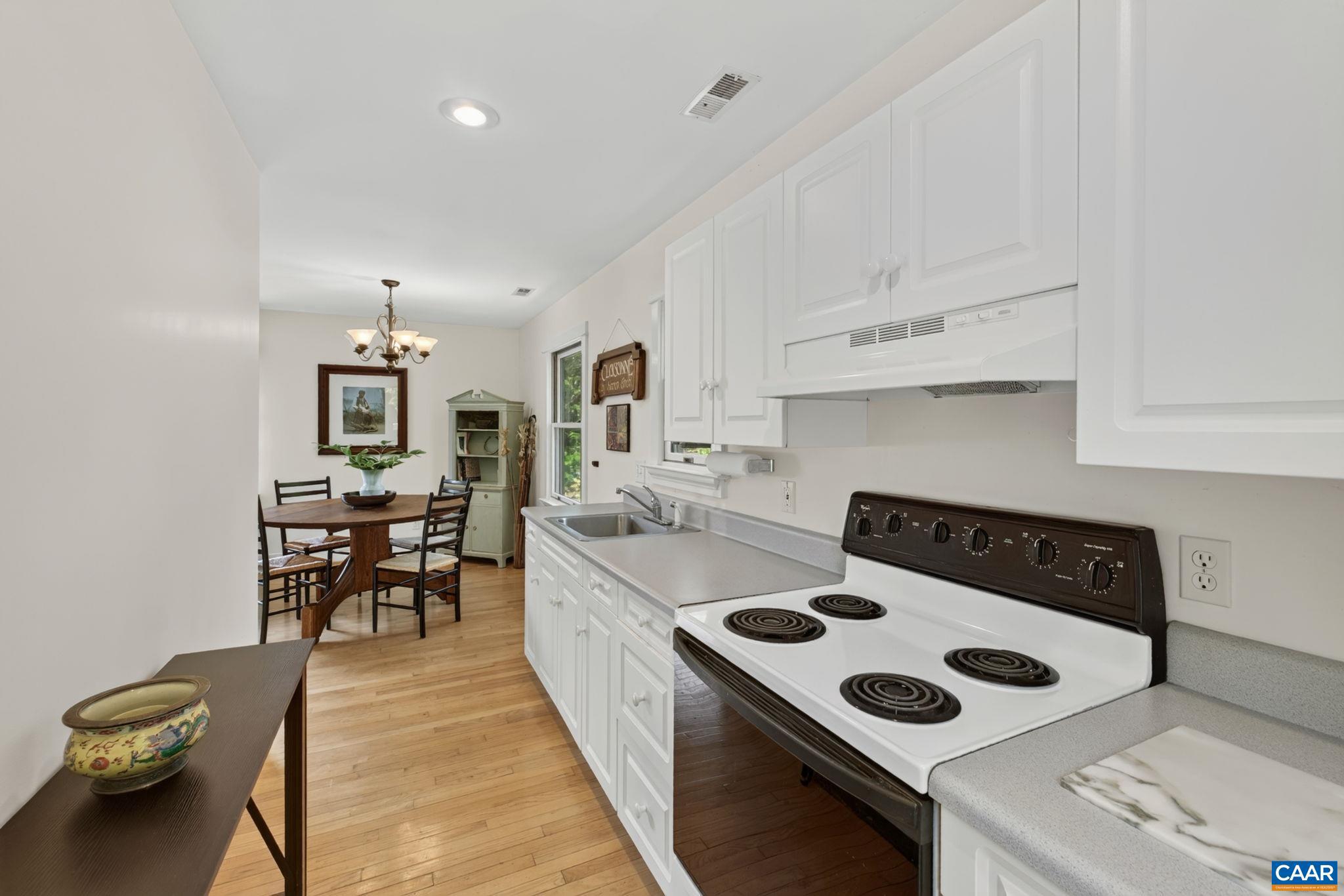 6285 Jarmans Gap Road Crozet, VA 22932 - Photo 32 of 65 a kitchen with a stove and a refrigerator